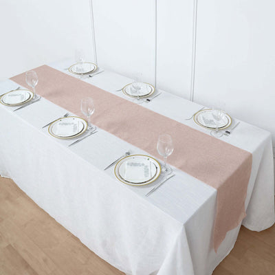 Elegant dining setup with pink and white table runners and fine dinnerware.