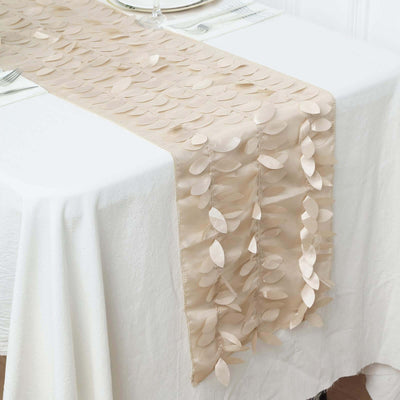 Beige table runner with leaf design on a white table setting.