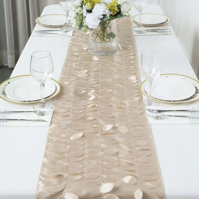Elegant beige table runner with embossed leaf design on a dining table setting.