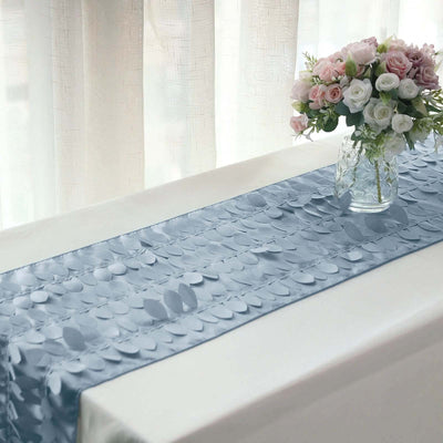 Blue sequin table runner on a table with a vase of flowers.