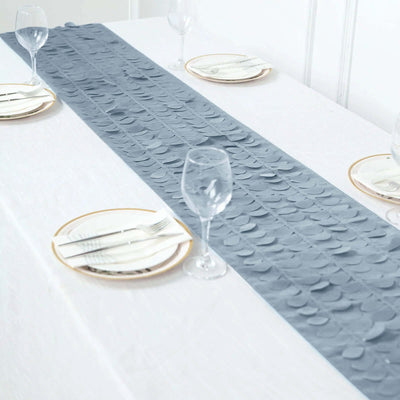 Gray circular table runner on a white dining table with plates and glasses.