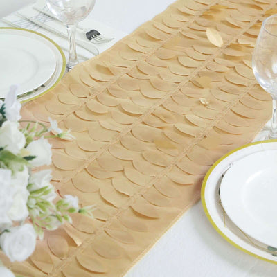 Elegant gold table runner with scalloped design on a dining table.