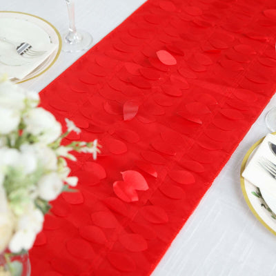 Red heart-shaped table runner for festive table settings.