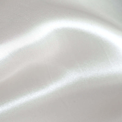 Smooth, glossy white satin fabric with gentle folds and texture.