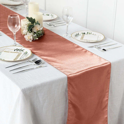 Elegant rose gold table runner on a beautifully set dining table.