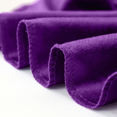 Purple fabric with soft texture and scalloped edges.