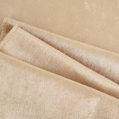 Beige velvet fabric showcasing soft texture and sheen.