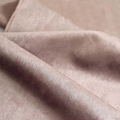 Soft pink velvet fabric texture close-up shot.