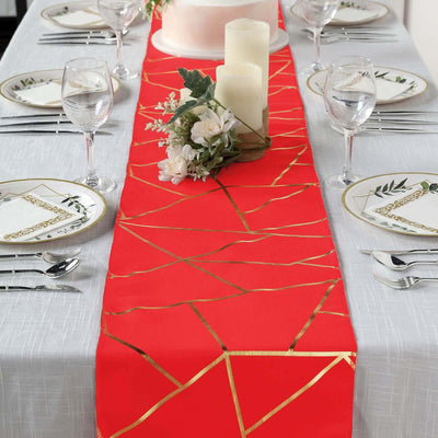 Red table runner with golden geometric pattern set for a dining table.
