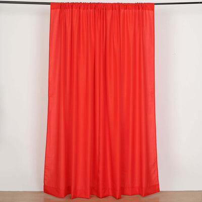 Red curtain panel on a plain backdrop.