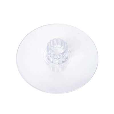 Clear plastic cake stand with fluted center.