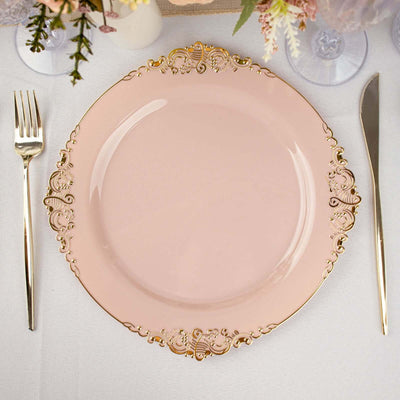Elegant pink plate with gold detailing, styled with cutlery.