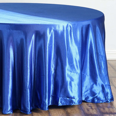 Shiny blue tablecloth draped elegantly over a round table.