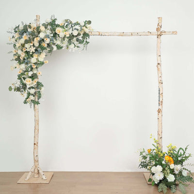 Wooden flower arch with white and yellow blooms, ideal for weddings or events.