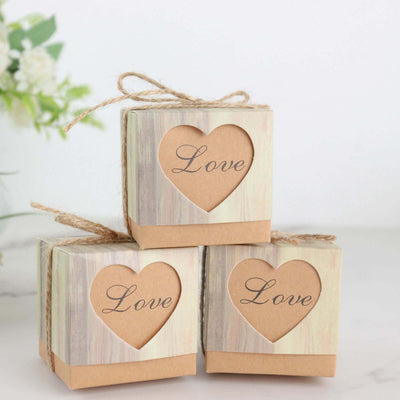 Three decorative gift boxes with "Love" text and heart cutouts.