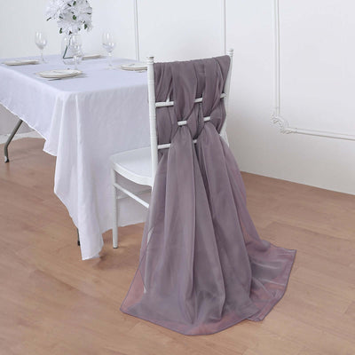 Lavender chair sash draped elegantly on a white chair at a dining table.