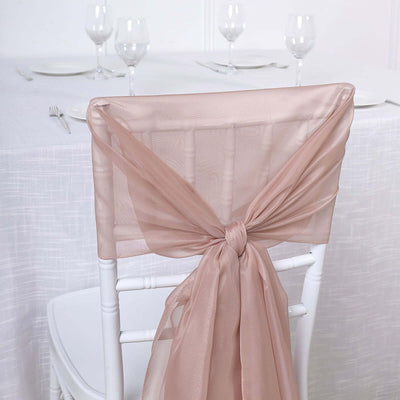 Chair with elegant taupe sash tied in a bow for event decor.