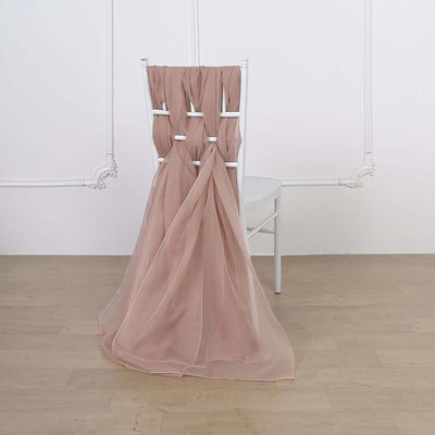 Pink chiffon chair cover draped elegantly on a white chiavari chair.