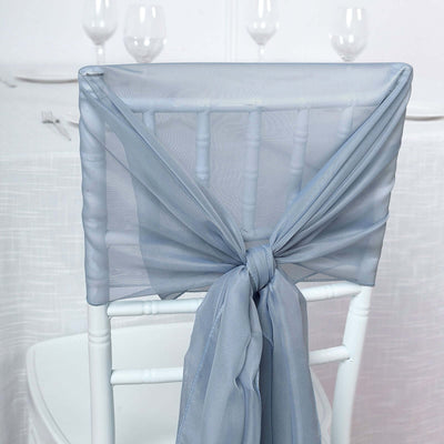 Gray chair sash tied in an elegant bow on a white chair.