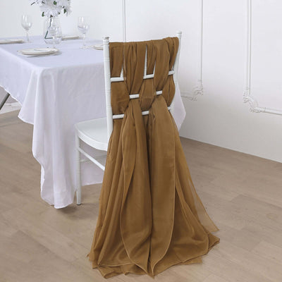 Elegant brown chair sash draping over a white chair at a dining table.