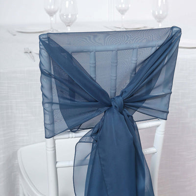 Navy organza chair sash tied on a white chiavari chair