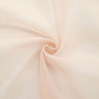 Soft peach fabric with smooth texture and gentle drape.
