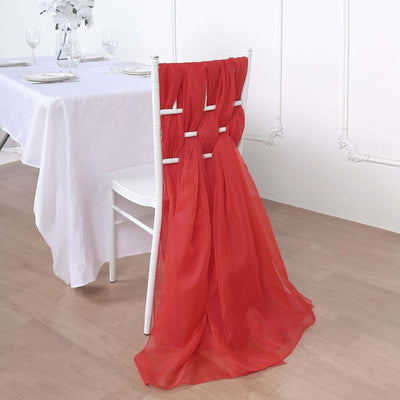 Red chair sash draping elegantly over a white chair at a dining table.