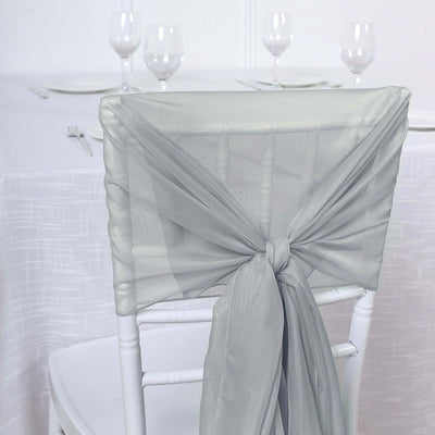 Silver chair sash tied elegantly on a white chiavari chair.