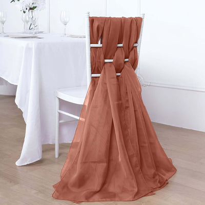 Rust-colored chair sash draped elegantly over a white chair.