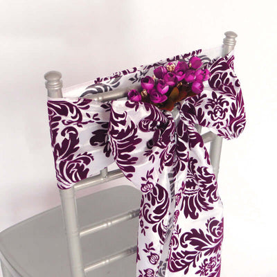 Purple and white chair sash with floral accent for events