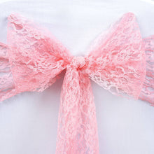Pink lace bow tied to a white cloth jute burlap | cheesecloth & lace chair sashes