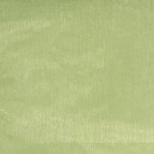 A close up of light green organza fabric texture