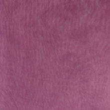 A close up of a purple organza fabric texture