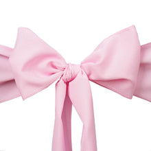 A close up of Polyester chair sashes in Pink color tied into an Elegant bow on a white background