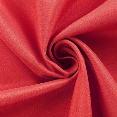 Red fabric texture in a swirling pattern.