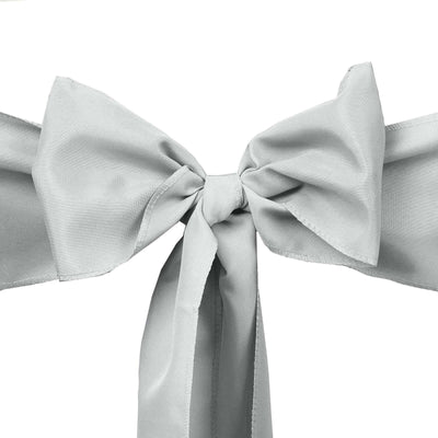 Gray satin ribbon bow on a plain background