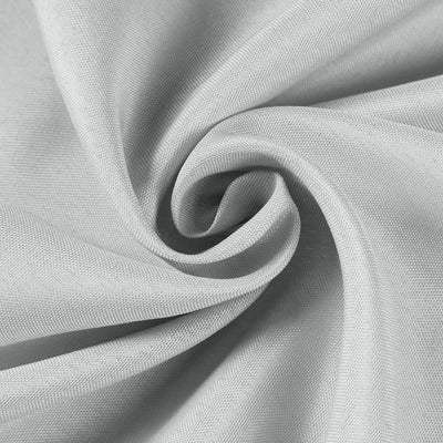 Close-up of soft gray fabric texture in a swirling pattern.