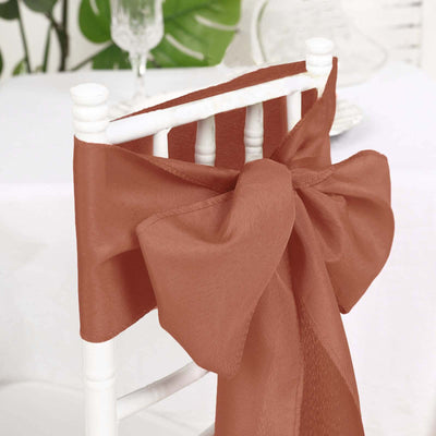 Rustic brown chair sash bow for elegant event decor.