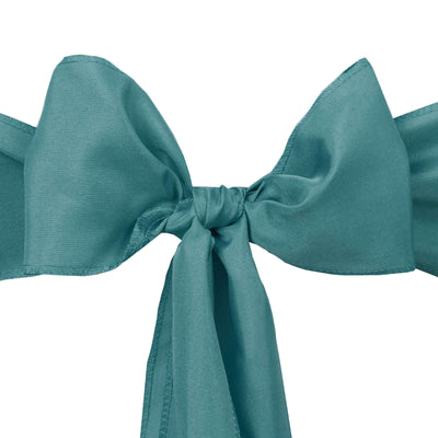 Teal silk bow on a white background