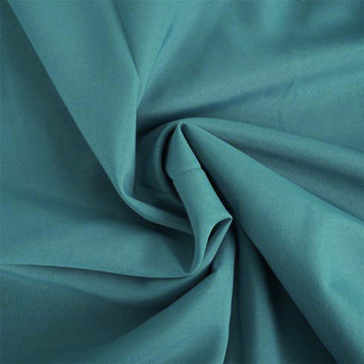 Teal fabric with soft texture, ideal for various sewing projects.