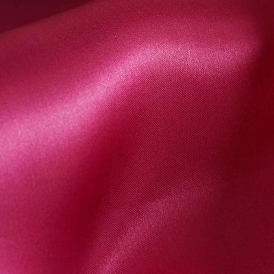 Vibrant fuchsia satin fabric with a smooth, glossy texture.