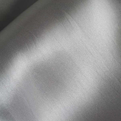 Silver satin fabric texture close-up showing smooth, shiny surface.