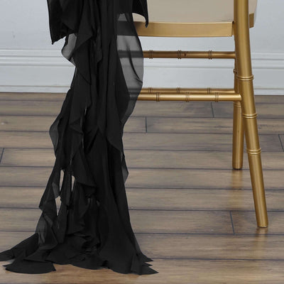 Black ruffled fabric draped elegantly over a gold chair leg.