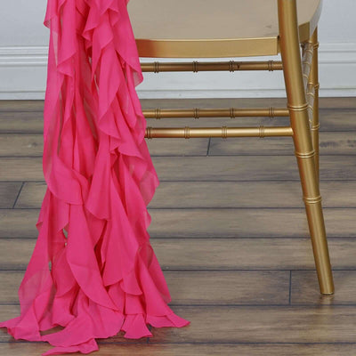 Pink ruffled fabric draped over a gold chair leg.