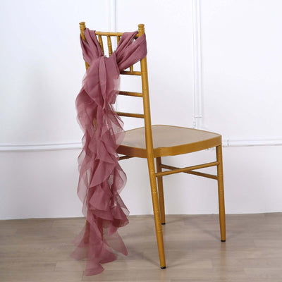 Pink chiffon drape tied elegantly on a gold chiavari chair