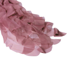 A close up of chiffon fabric in pink color with ruffled texture