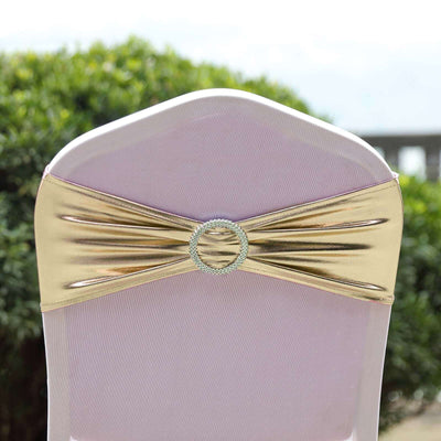 Gold chair sash with rhinestone buckle for elegant decor.