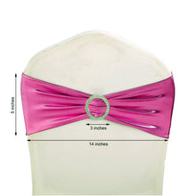 A pink spandex fitted chair sash with a green rhinestone ring measures 5 inches and 14 inches