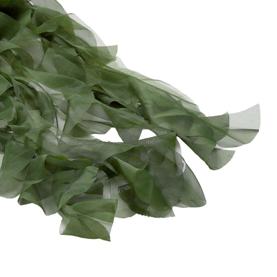 Green sheer ribbon with flowing, textured edges, perfect for crafts or decorations.
