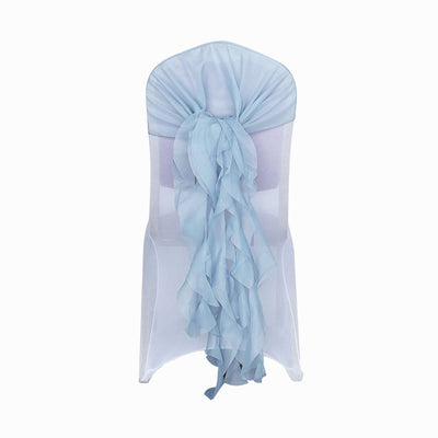Light blue chair cover with ruffled sash on a white backdrop
